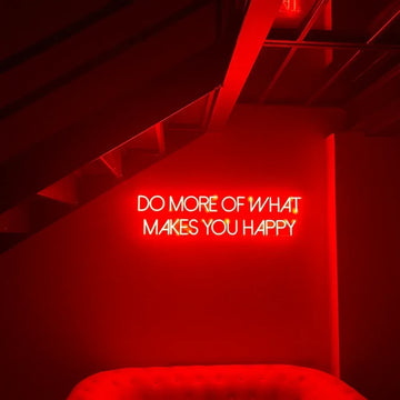Néon rouge à texte blanc installé sur un mur sombre dans un espace intérieur