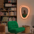 Front view of the Dreamy Glow Mirror with neon illumination.
