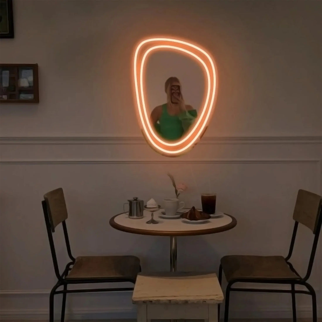 Front view of the Dreamy Glow Mirror with neon illumination.
