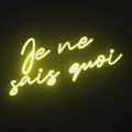 Watch the Je Ne Sais Quoi Neon Sign light up, filling your space with elegance and mystery.