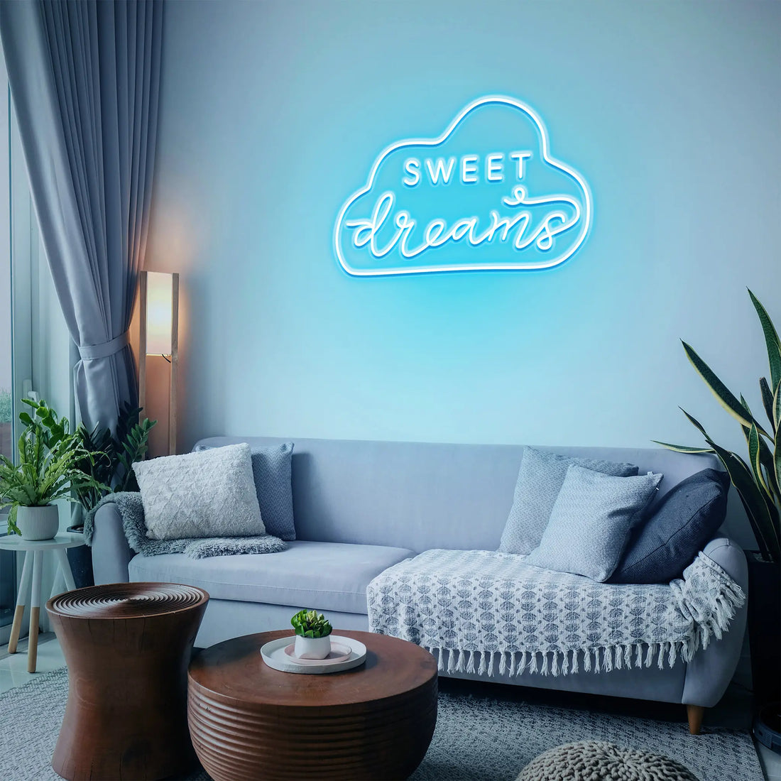 "Sweet Dreams Neon Sign glowing softly in a cozy bedroom setting."